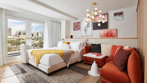 A render of a hotel room inside the Virgin Hotels property with views of The Strip of Las Vegas