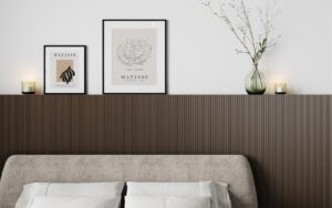 oak veneer headboard with framed pictures and vase above bed