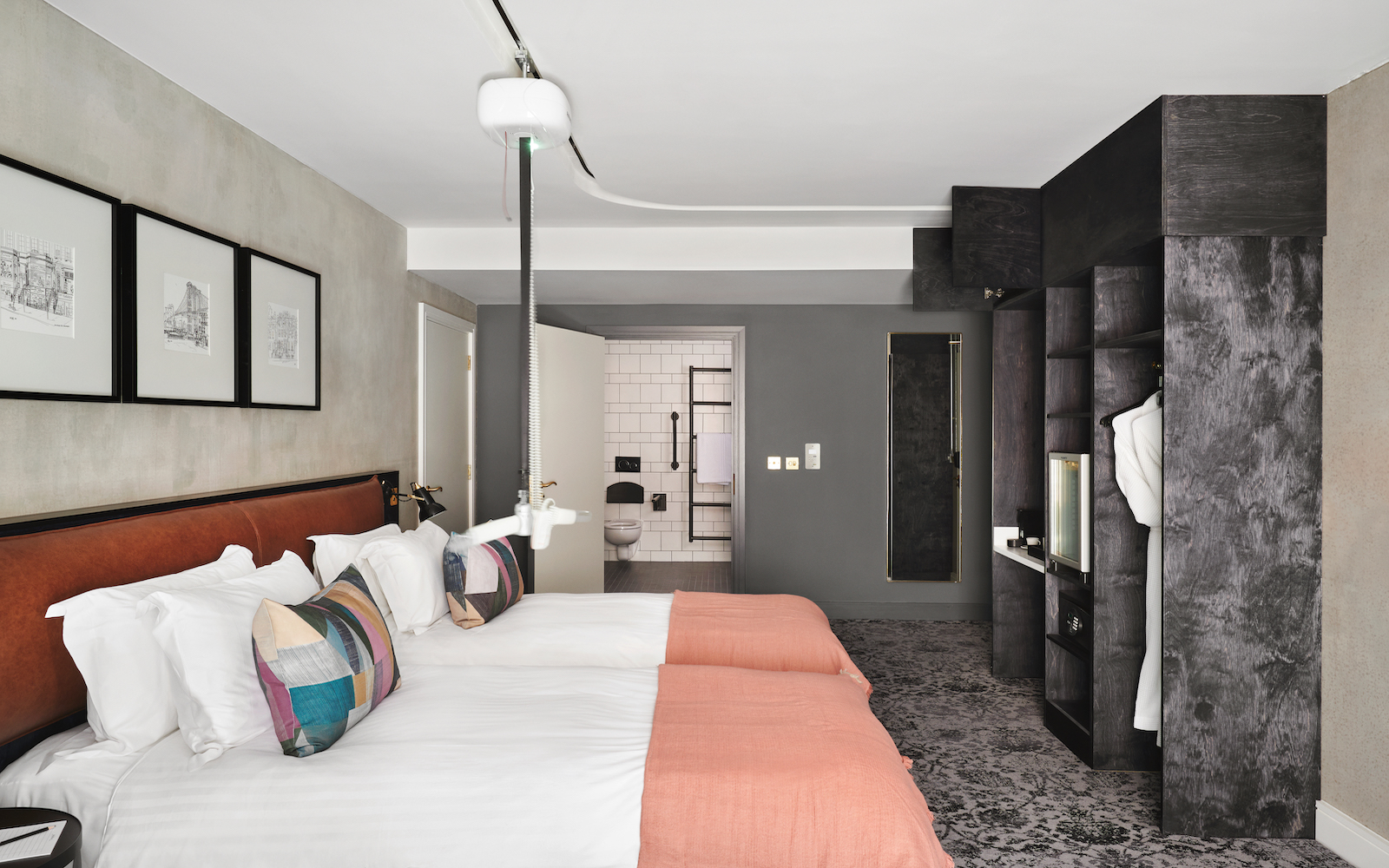 An accessible guestroom inside Hotel Brooklyn, with extendable hoist above bed