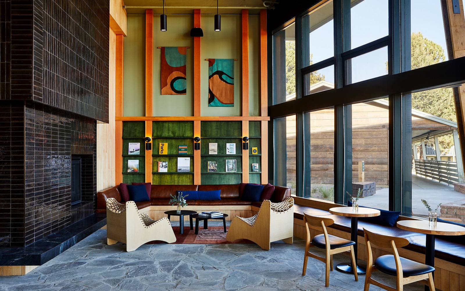 tiled and glass surfaces with wooden chairs in Trailborn lobby