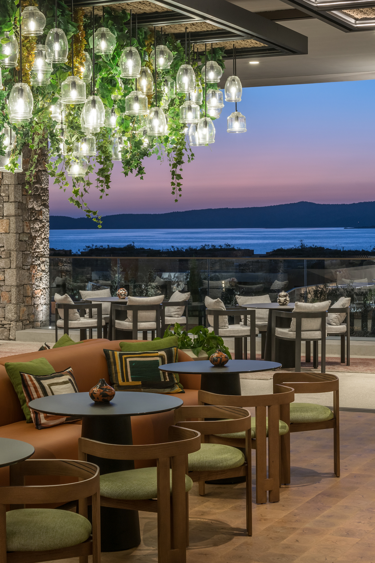 Dining area overlooking night sky and sea