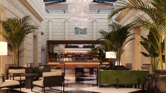 black and white chequered floor, palm trees and bar in the lobby at Casa Lucia