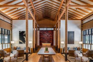 central table and seating area in beamed wooden building at Roku Kyoto