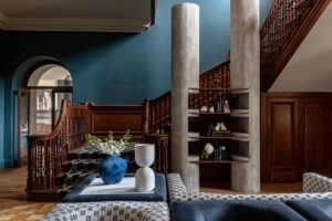 entrance hall painted in blue contrasts with wooded panelling