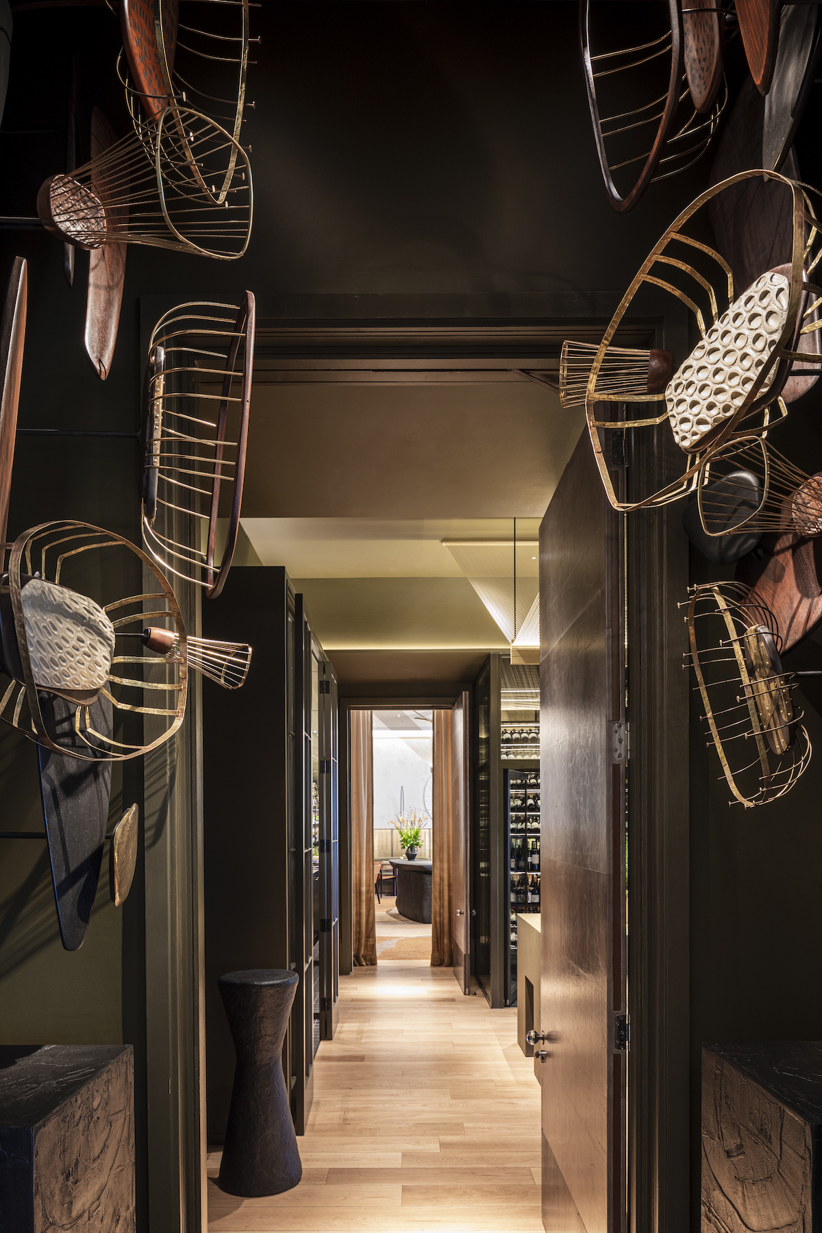 Entrance into Woven by Adam Smith at Coworth park, with saddles on ceiling