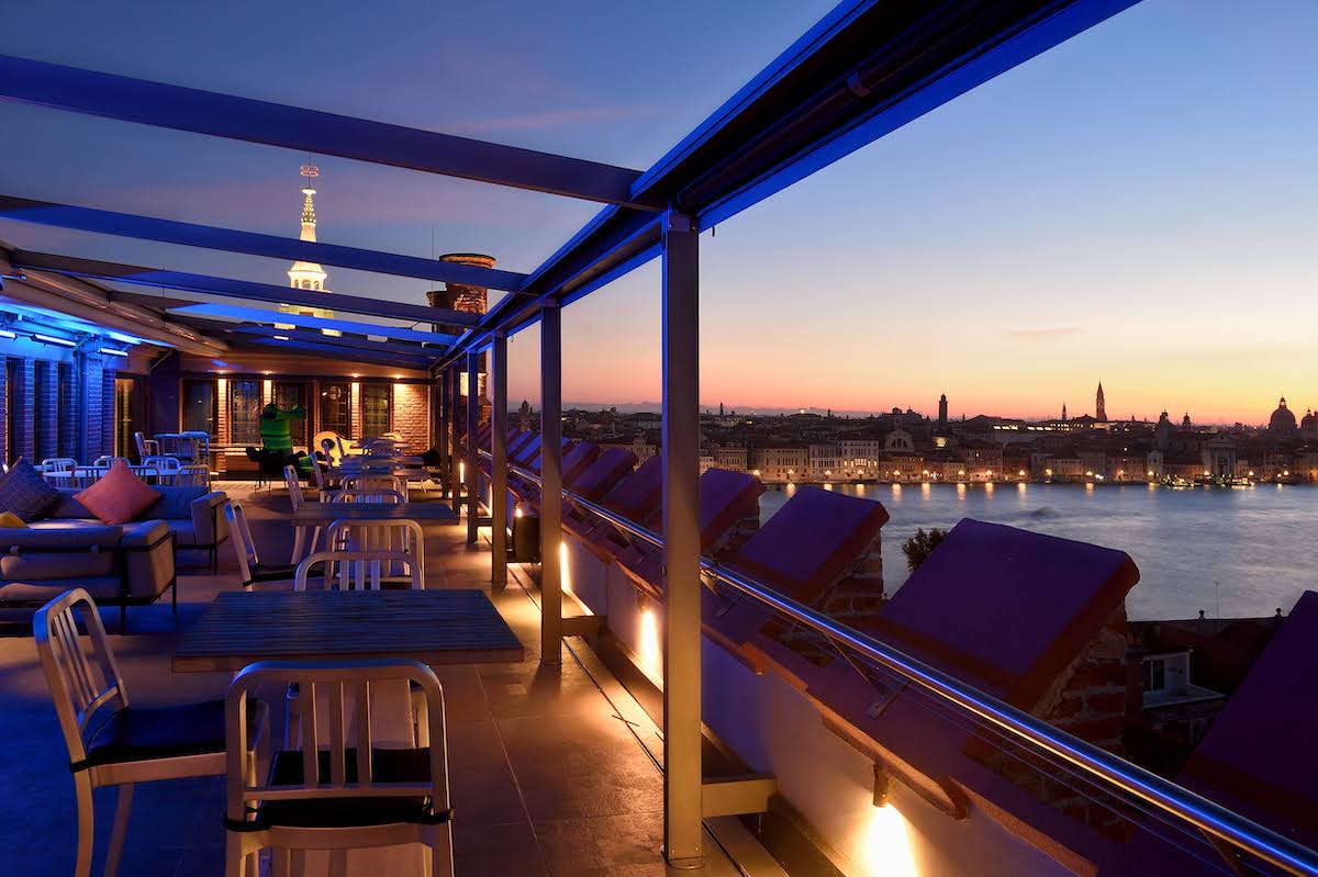 Skyline bar at night overlooking Venice