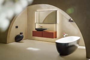 bathroom with bath, vanity and toilet in ilbagnoalessi range from laufen