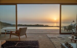 sunset view over the atlantic with chair in foreground looking out from villa over private pool at La Fiermontina Ocean