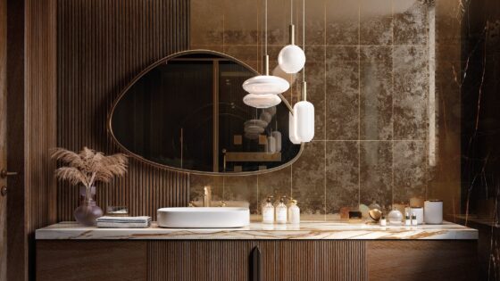 reflective gold tiles behind bathroom vanity and mirror