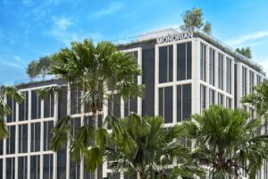 palm trees and exterior facade of Mondrian Singapore Duxton