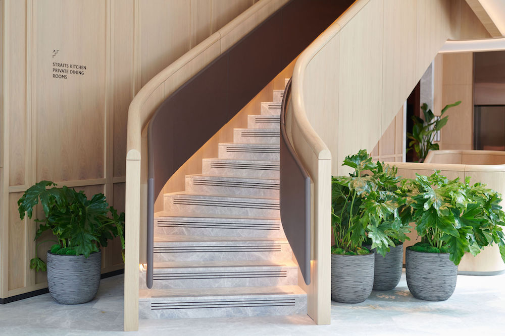 Planters and contemporary starcase in lobby of Pan Pacific