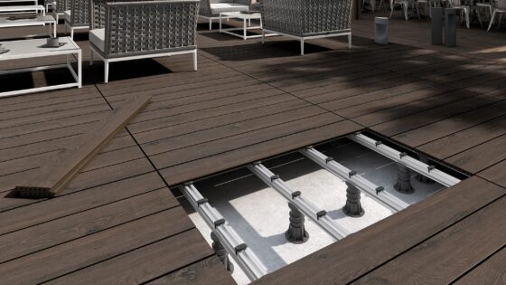 deck with furniture and decking with exposed section showing raised access