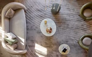 aerial view looking down on cream curved sofa on carpet with curved lines in white and cream by Modieus in the Playford Hotel