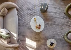 aerial view looking down on cream curved sofa on carpet with curved lines in white and cream by Modieus in the Playford Hotel