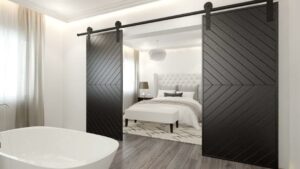 sliding wooden barn doors between bedroom and bathroom