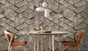 wooden treen inspired wallcovering behind a restaurant table and wooden chairs with white minimalist lighting above the table