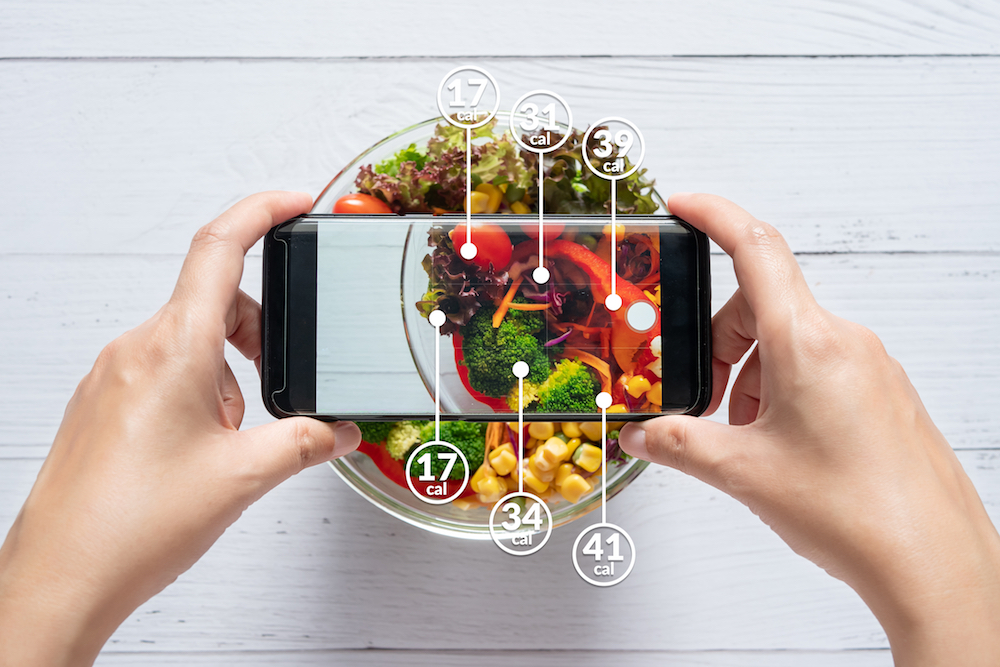 An image of a person taking a picture of healthy food